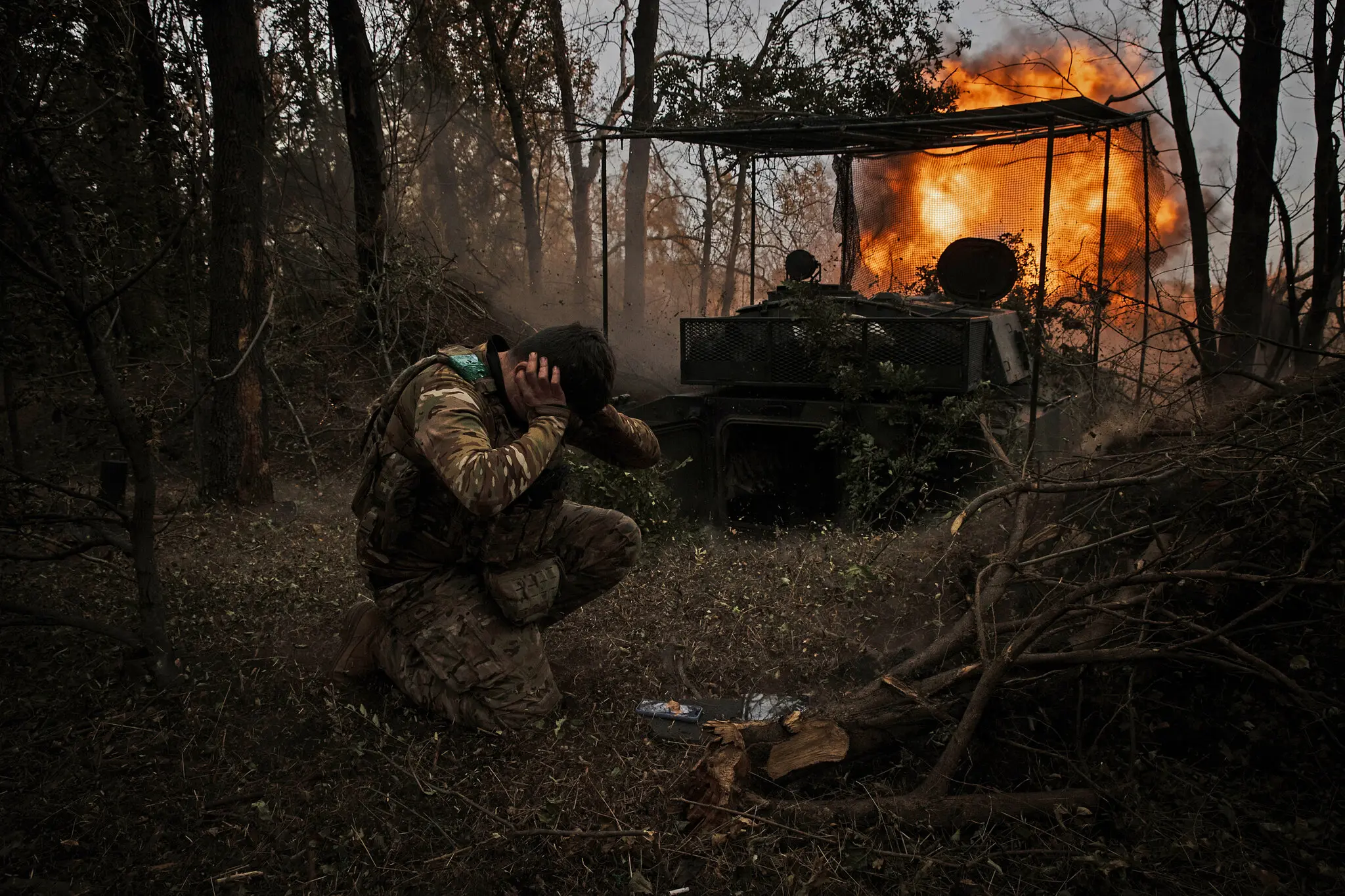 An artillery unit of the Ukrainian military’s 68th Jaeger Brigade fires a howitzer at Russian positions outside a town in Donbas in October.