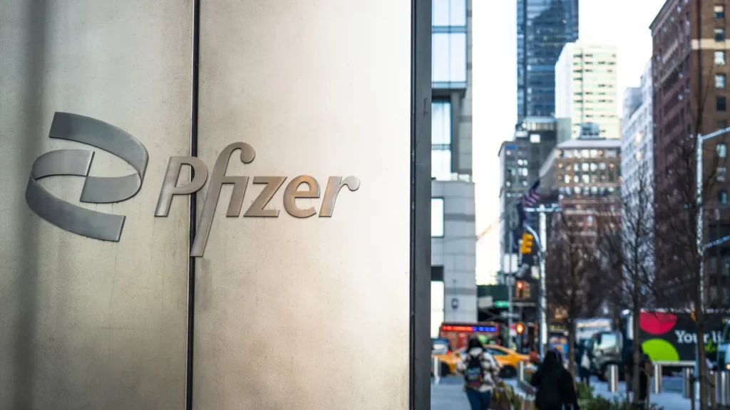 Pedestrians in Manhattan pass Pfizer’s headquarters building. The company on Nov. 20, 2024, named a new chief scientific officer and head of R&D. George Clerk via Getty Images