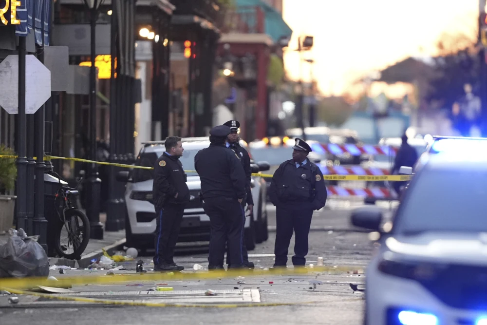 Emergency workers attend to the scene on Bourbon Street after a vehicle drove into a crowd on New Orleans’ Canal and Bourbon streets on Wednesday.Gerald Herbert / AP