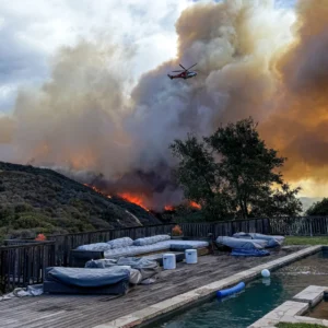 The brush fire, spotted Tuesday morning beyond the backyard of a Palisades Highlands home, spread quickly despite firefighters’ attacks. Courtesy Stephanie Libonati