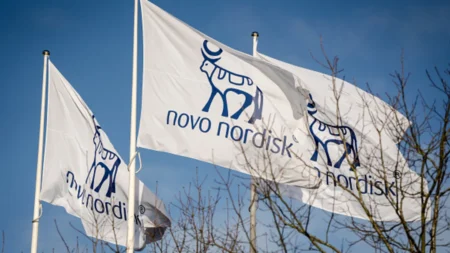 Flags with the logos of Danish drugmaker Novo Nordisk, maker of the blockbuster diabetes and weight-loss treatments Ozempic and Wegovy are pictures while the company presents the annual report at Novo Nordisk in Bagsvaerd, Denmark, on February 5, 2025. (Mads Claus Rasmussen/Afp/Getty Images)