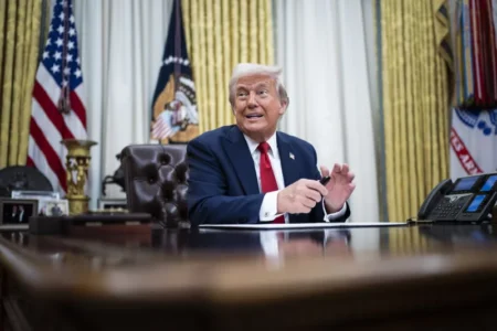 President Trump speaks to reporters and signs an executive order in the Oval Office on March 31. Jabin Botsford:The Washington Post via Getty Images