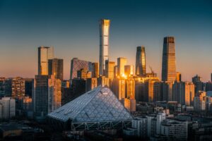 The photo shows the CBD area bathed in the golden light of the setting sun. (Photo by Mao Zehao)