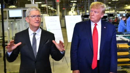 US President Donald Trump (r) and Apple CEO Tim Cook speak to the press during a tour of the Flextronics computer manufacturing facility where Apple’s Mac Pros are assembled in Austin, Texas, on November 20, 2019. (Mandel Ngan/AFP/Getty Images)