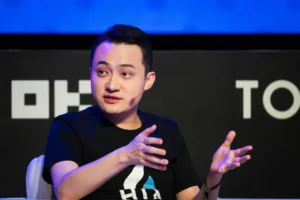 Justin Sun, founder of Tron, eats a banana that forms part of the artwork Comedian during a news conference in Hong Kong. (Bloomberg)