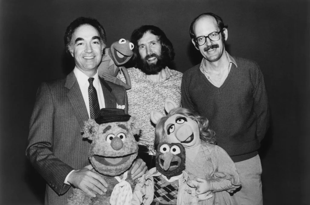 David Lazer of the Jim Henson Company, left, with Jim Henson, the producer Frank Oz and several Muppets in 1981. “What David brought to the company was class,” said Brian Henson, Mr. Henson’s son. (Universal/Courtesy Everett Collection)
