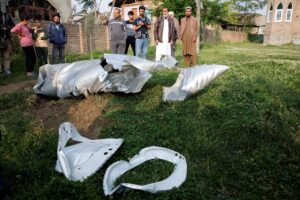 Metal debris lies on the ground in Wuyan in India-administered Kashmir's Pulwama district on Wednesday. (Sharafat Ali/Reuters)