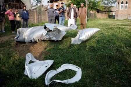 Metal debris lies on the ground in Wuyan in India-administered Kashmir's Pulwama district on Wednesday. (Sharafat Ali/Reuters)