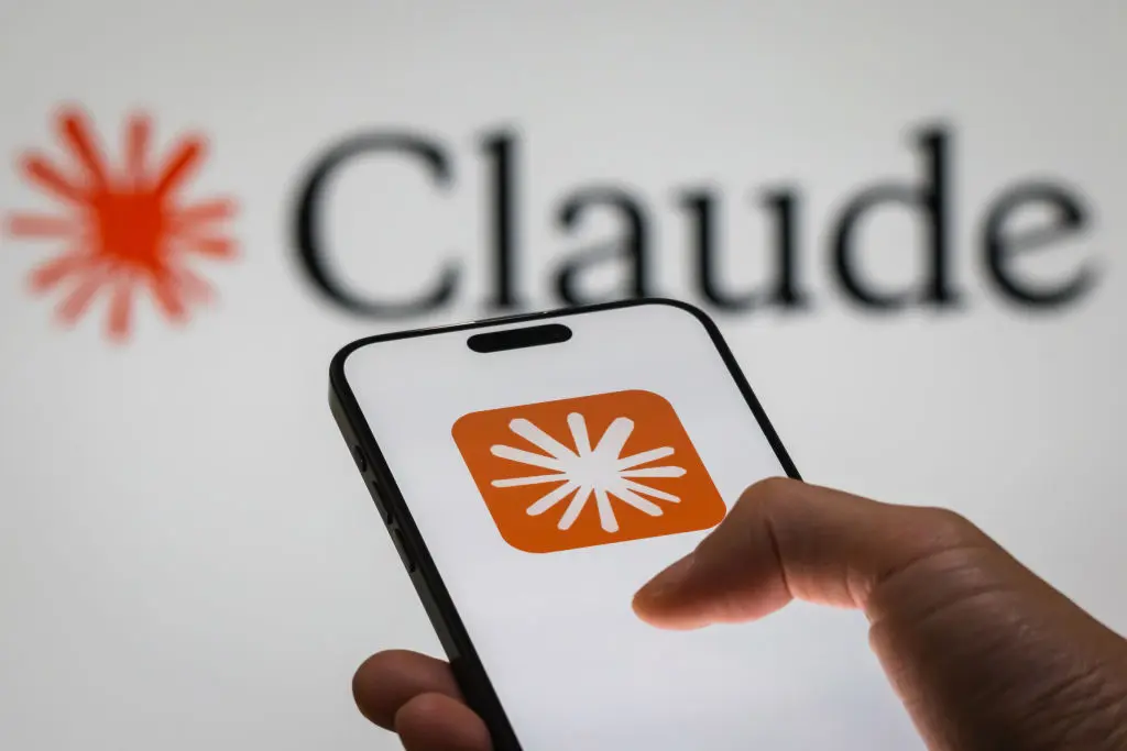 A smartphone displaying the logo of Claude, an AI language model developed by Anthropic. (Cheng Xin/Getty Images)