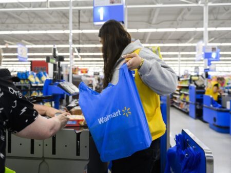 Employees are seen working at a Walmart in Vaughan, Ont., on Wednesday, July 2, 2024. (Christopher Katsarov /THE CANADIAN PRESS)