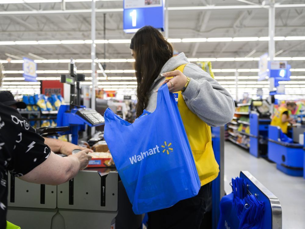 Employees are seen working at a Walmart in Vaughan, Ont., on Wednesday, July 2, 2024. (Christopher Katsarov /THE CANADIAN PRESS)