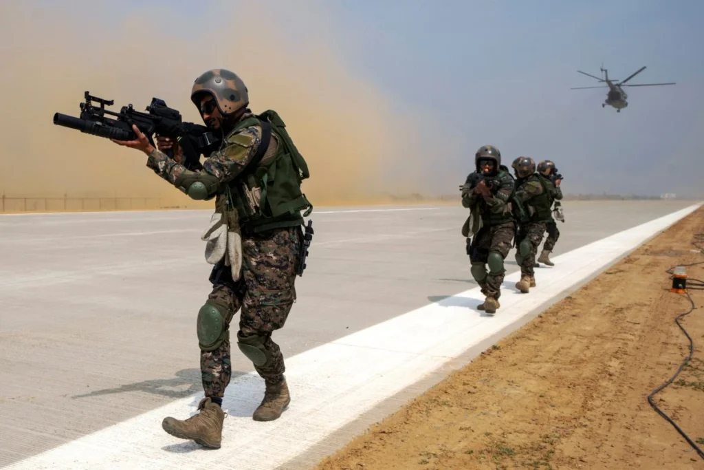 Indian army and Air Force soldiers demonstrate their combat skills during a drill on May 2. (Photo: AP)