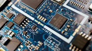Semiconductor chips are seen on a circuit board of a computer on February 25, 2022. (Florence Lo/Reuters)