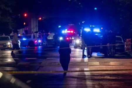 FBI agents and police officers work outside the Capital Jewish Museum in the early hours Thursday in Washington, D.C., following a shooting Wednesday night that left two people dead. (Alex Wroblewski/AFP/Getty Images)