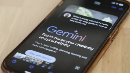 Google's Gemini AI chatbot shown on a phone in March 2024 in New York City. Google is now using a version of its Gemini AI model to fight scams on Chrome and Search. (Michael M. Santiago/Getty Images/File)