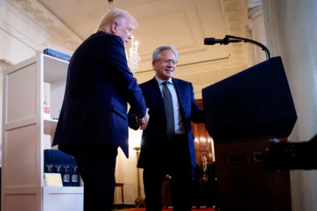 President Donald Trump welcomes Nvidia CEO Jensen Huang as he speaks Wednesday at the White House during an “Investing in America” event. CEOs joined Trump to highlight companies and their investments in the United States. (Andrew Harnik/Getty Images)