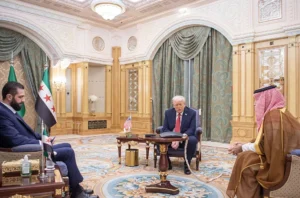 President Trump, accompanied by Saudi Crown Prince Mohammed bin Salman, meets with Syria's President Ahmed al-Sharaa in Riyadh on Wednesday, May 14. (Bandar Al-Jaloud/Getty Images)