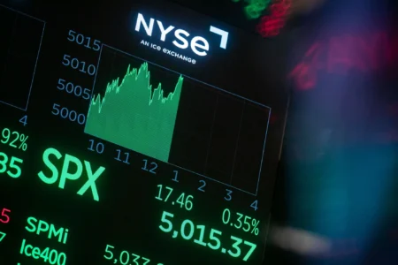 A monitor displays the S&P 500 index crossing 5000 on the floor of the New York Stock Exchange in New York on Feb. 9. (Michael Nagle/Bloomberg)