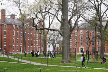 Students walk through Harvard Yard, April 27, 2022, on the campus of Harvard University in Cambridge (AP Photo/Charles Krupa, File)