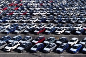 New Subaru cars sit in a storage lot at in Richmond, California. Imported vehicles like these now face a 25% tariffs. © Justin Sullivan/Getty Images