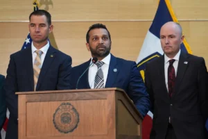 Kash Patel speaks at a news conference, Friday, Sept. 12, 2025, in Orem, Utah, as Utah department of public safety commissioner Beau Mason, left, and Utah Gov. Spencer Cox listen. © AP Photo/Lindsey Wasson