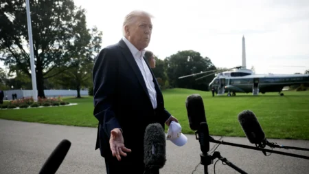 President Trump speaks to members of the media as he departs the White House on Friday. © Kevin Dietsch/Getty Images