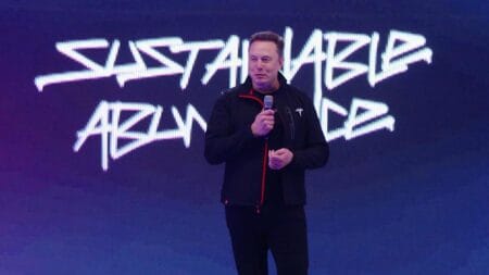 Elon Musk speaking at the 2025 Tesla shareholder meeting. ·© Tesla.com