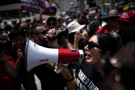 Far-right activist Laura Loomer protests the indictment of Donald Trump outside federal court in Miami in 2023. © Thomas Simonetti/For The Washington Post