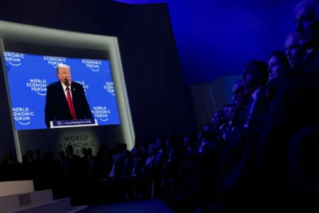 Members of the Trump administration and other attendees listen to U.S. President Donald Trump's remarks during the 56th annual World Economic Forum (WEF), in Davos, Switzerland, on Wednessday. © Jonathan Ernst/Reuters