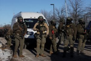 Law enforcement stand guard while people protest outside the Bishop Henry Whipple Federal Building, after the fatal shootings of Renee Nicole Good and Alex Pretti by federal immigration agents, in Minneapolis, Minnesota, U.S., January 30, 2026. (Reuters)