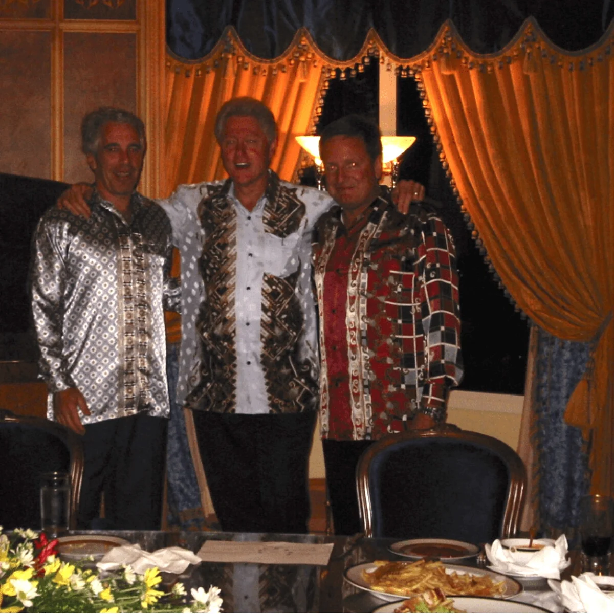 Jeffrey Epstein (left) and Bill Clinton (center) in a photo released by the justice department on Friday. (Department Of Justice/Zuma Press Wire/Shutterstock)