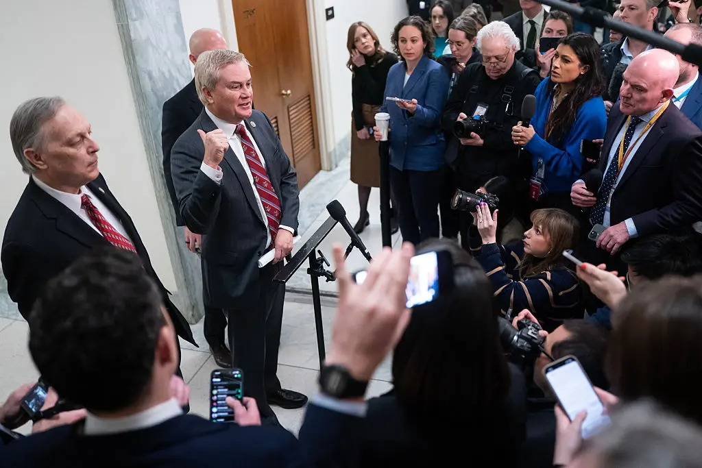 Rep. Andy Biggs (R, Ariz.) and House Oversight Committee chair Rep. James Comer (R, Ky.) speak to members of the media after a closed-door virtual deposition with Ghislaine Maxwell on Capitol Hill in Washington, D.C., on Feb. 9, 2026. (Nathan Howard—Bloomberg/Getty Images)