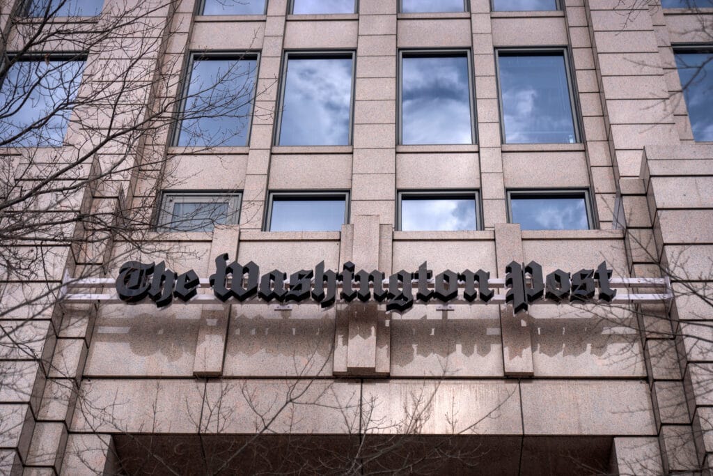 A sign for The Washington Post is seen at the company's offices Jan. 26, 2026, in Washington. (Mark Schiefelbein/AP)