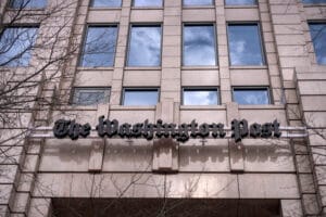 A sign for The Washington Post is seen at the company's offices Jan. 26, 2026, in Washington. (Mark Schiefelbein/AP)