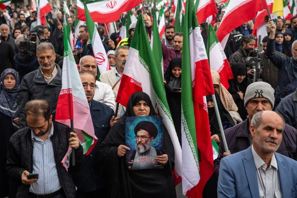 People demonstrating in support of the government in Tehran on Saturday.(The New York Times)