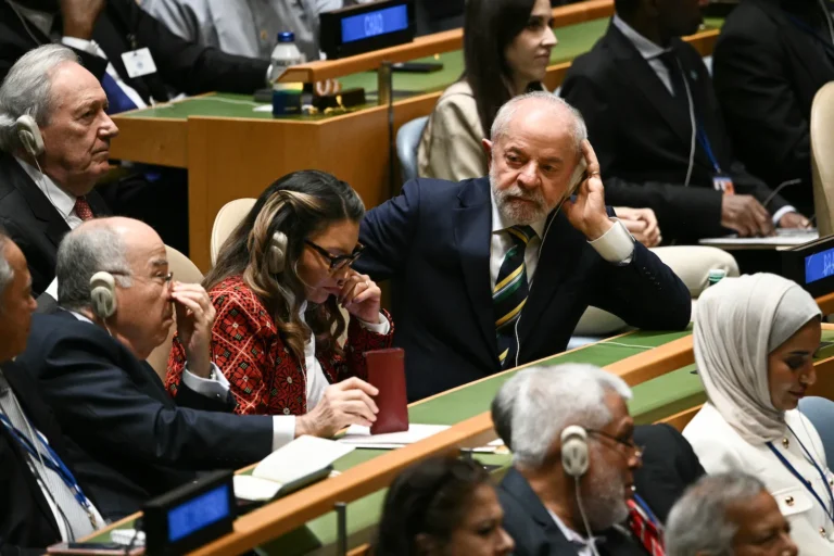 Brazilian President Luiz Inácio Lula da Silva listens as U.S. President Donald Trump delivers remarks to the United Nations General Assembly in New York on Sept. 23. (Brendan Smialowski/AFP via Getty Images)